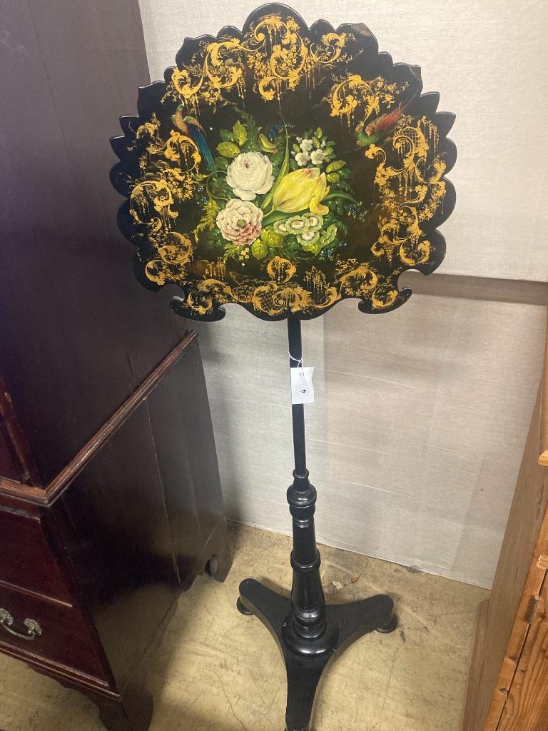 A Victorian ebonised pole screen with papier mache banner, height 130cm